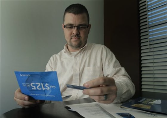 Cory Heck is switching banks after Bank of America announced plans to charge $5 per month for using debit cards. It may be a hassle, but he's fed up enough to make the effort.